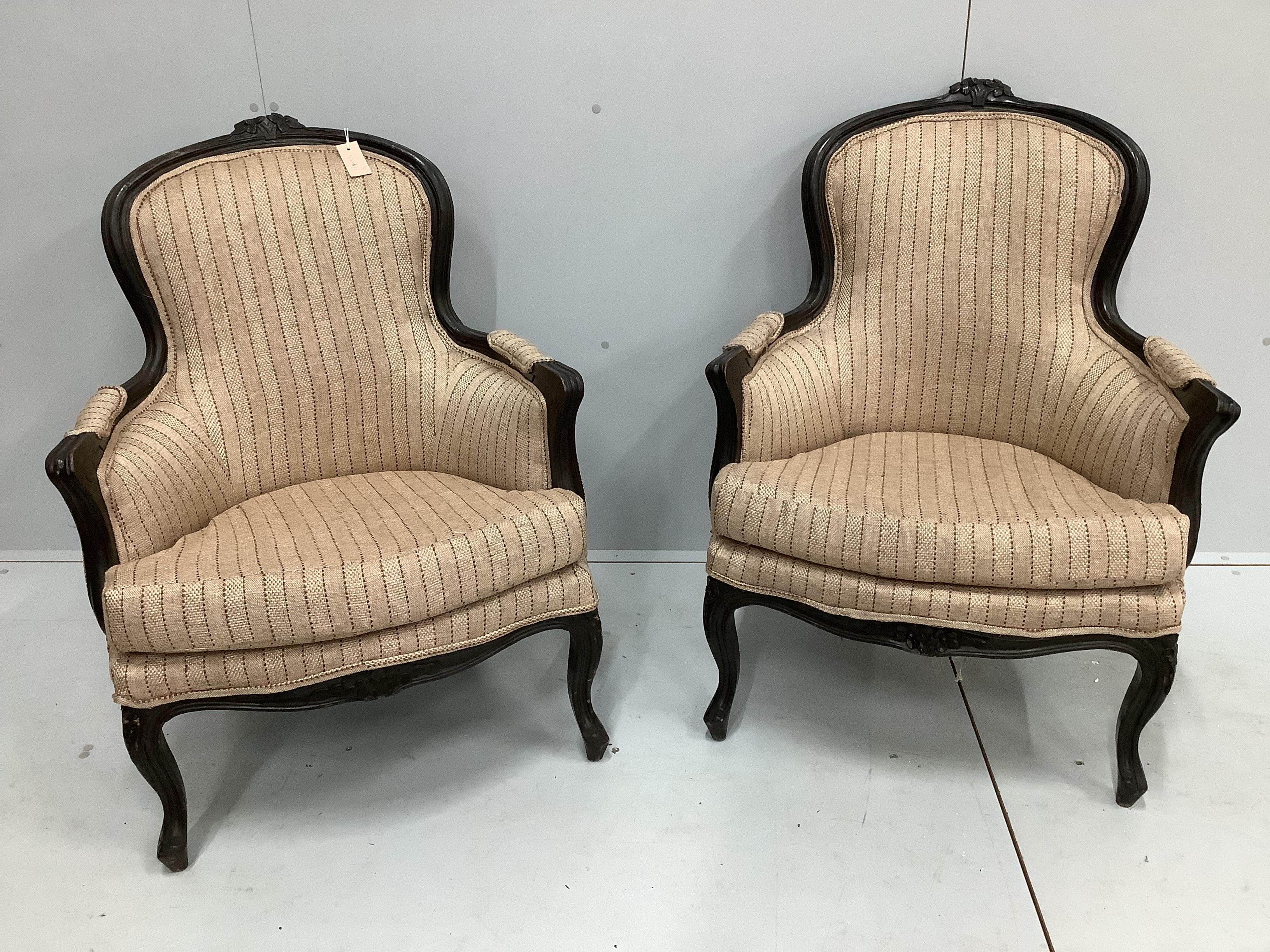 A pair of 19th century French ebonised spoonback armchairs, width 70cm, depth 58cm, height 92cm